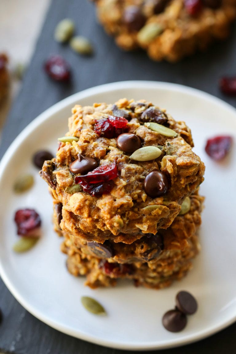 Pumpkin Breakfast Cookies stacked on a white plate. 